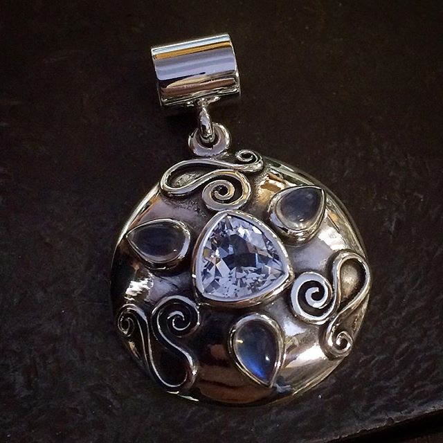 White Topaz Trillion with three Moonstone Teardrops set in Sterling Silver. Pendant with tube bail. This piece is 9 years old! It's an unusual piece still looking for its forever home:)