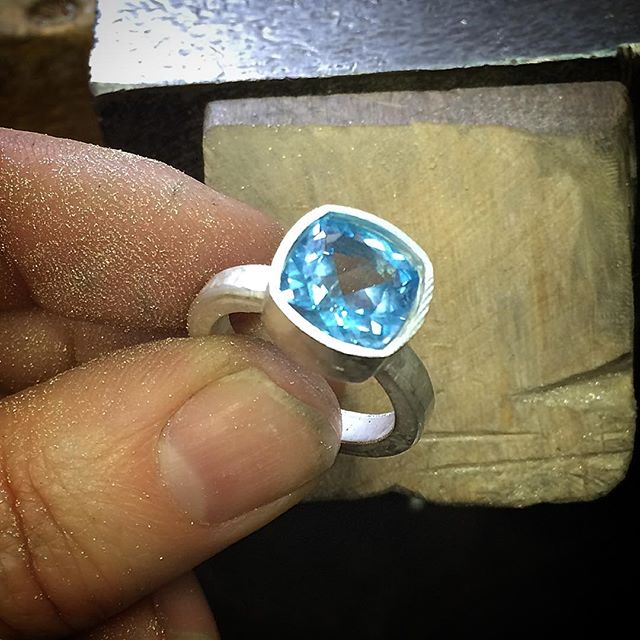 This lil cushion cut beauty coming up nice for summer stock! You won't see many enhanced gems in my work these days at all but I'm a sucker for the odd little heat treated blue topaz I wear a few myself!