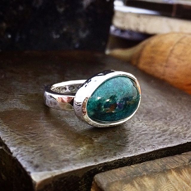 This beautiful deep marine blue-green Chrysocolla variety from Arizona was a little cab I cut myself. It took a very nice shine! Much better in real life! Set in Sterling Silver, beaten and oxidised