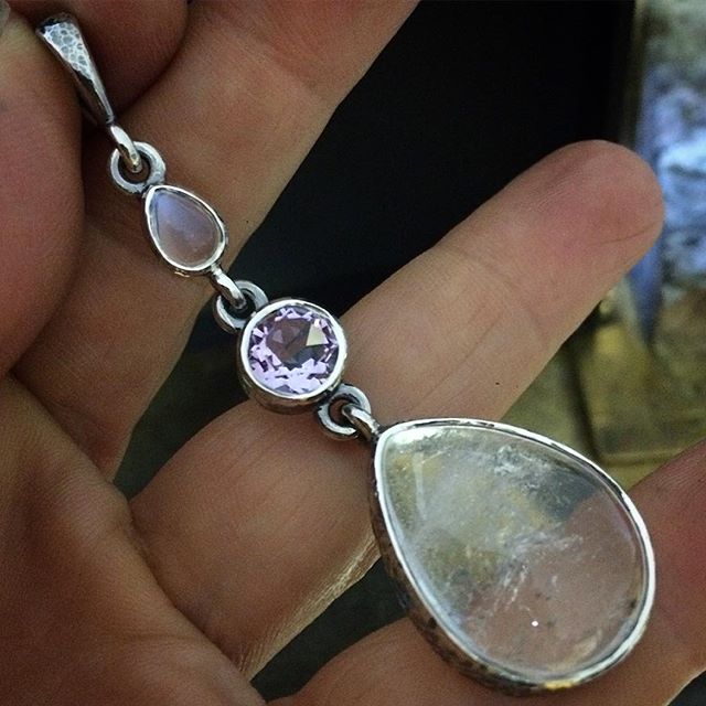 Last gallery stock of the year heading out tomorrow morning! This pretty and unusual pendant is made with a tiny moonstone teardrop, amethyst and a clear quartz teardrop I cut and polished myself with glittery inclusions giving it an icy look. Will be a great summer piece! There are earrings to match too.  You will find it @peninsulagalleries in Red Hill Victoria