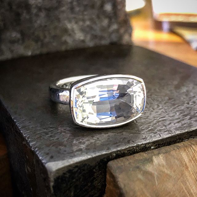 So on Friday I also finished this lovely chunky silver Killiecrankie Diamond/Topaz ring. It’s the one with the lovely inclusions a few posts back, I’ve included those photos here. They didn’t show up photos since  after I had the stone. In real life you can only just see them if you look really hard. I think they’ll show up more as the ring ages and the silver setting interior dulls a bit. Awesome stone. A bit irregular in shape but I tried to get the setting to look as symmetrical as I could. The setting part is slightly tapered with a high polish and light texture just around the rim of the stone. This ties in well with the tool marked band. Totally silver. I didn’t feel the desire to ad any gold to this one. It’s beautifully bright, white and pure The stone is completely colourless but you can see a lot of colour reflections in the pics. Enjoy!!