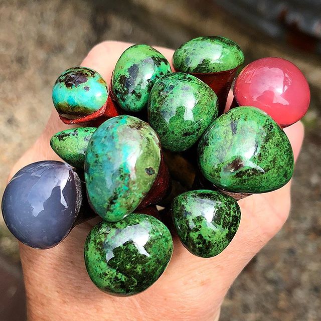 For everyone waiting to see more green stones, here is a bunch I’ve just finished. Nearly all of these are destined for rings. The red/purple ones are blue Chalcedony from Africa, you can see the red dopping wax through them. The green is Parrot Wing Jasper from Mexico and there’s one little Chrysocolla in there from Arizona. Very happy with the polish!!